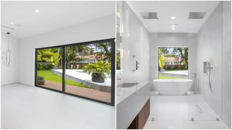 Ambiente amplio con ventanales corredizos al jardin y un bano moderno con banera blanca exenta.