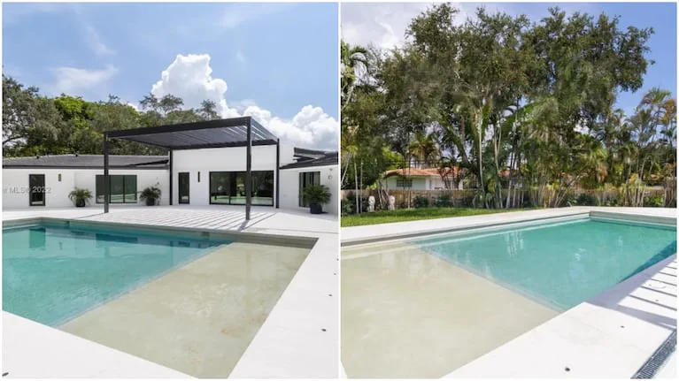 Patio con pileta de natación y pérgola metálica junto a una casa blanca.