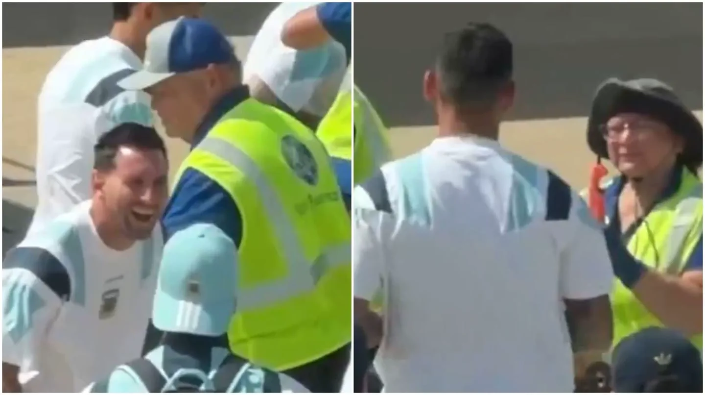 Lionel Messi sonrie junto a personal con chalecos refractarios en una pista.