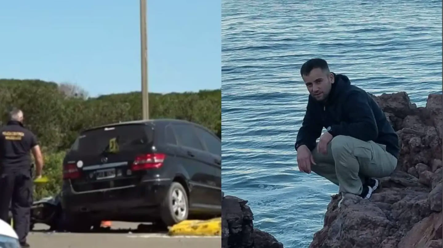 Composición con un auto negro chocado junto a un perito y un hombre agachado sobre rocas frente al mar.