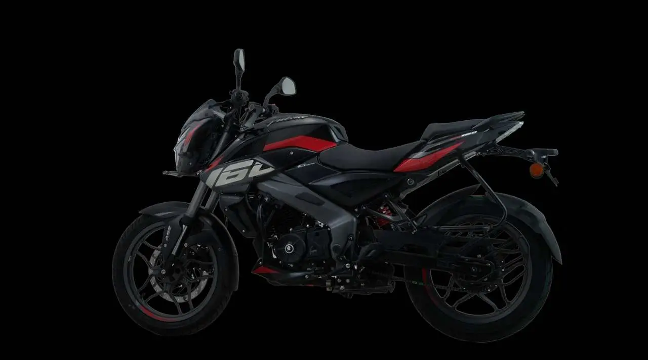 Una moto deportiva de color negro con detalles rojos sobre fondo oscuro.